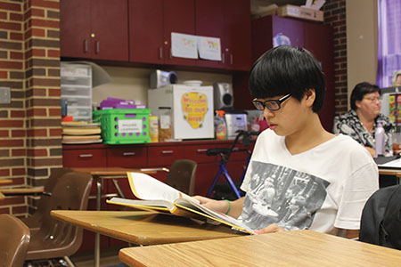 Studying for a test freshman Jing Ke sits in Ms. Days classroom. Ke is an ELL student in the Newcomers program.