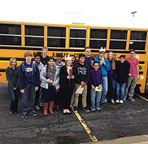 JV and Varsity Scholar Bowl teams stand next to the bus after a successful tournament in October.