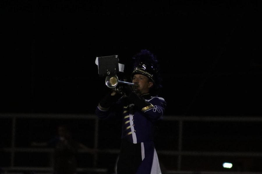 Caleb Brightwell playing his solo at a home game.